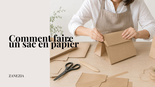 Personne réalisant un sac en papier sur un établi lumineux, en pliant et assemblant les différentes parties du sac avec du papier kraft et des outils de bricolage.